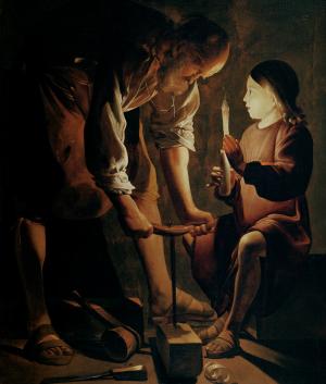 Tableau de La tour représentant saint Joseph travaillant le bois, éclairé par une bougie tenue par Jésus enfant